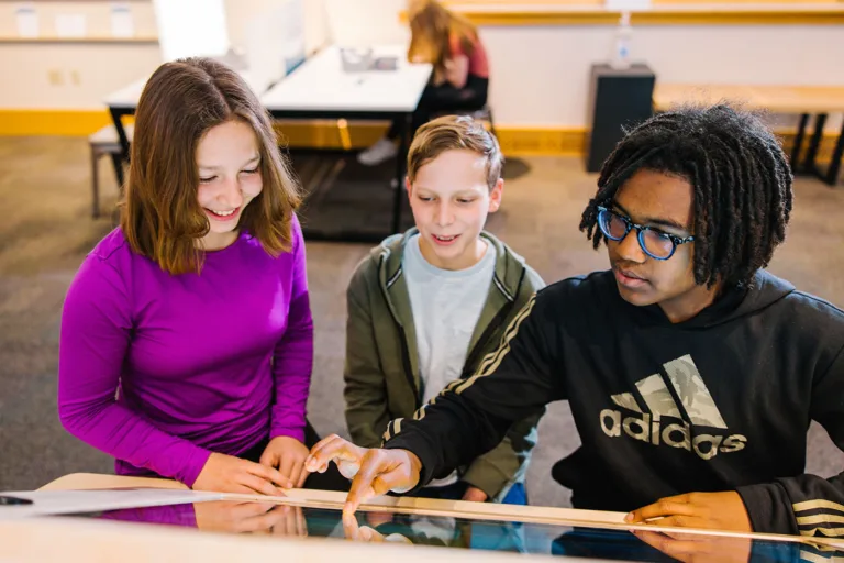 Students using kiosk activity at Wonder Media Exhibit
